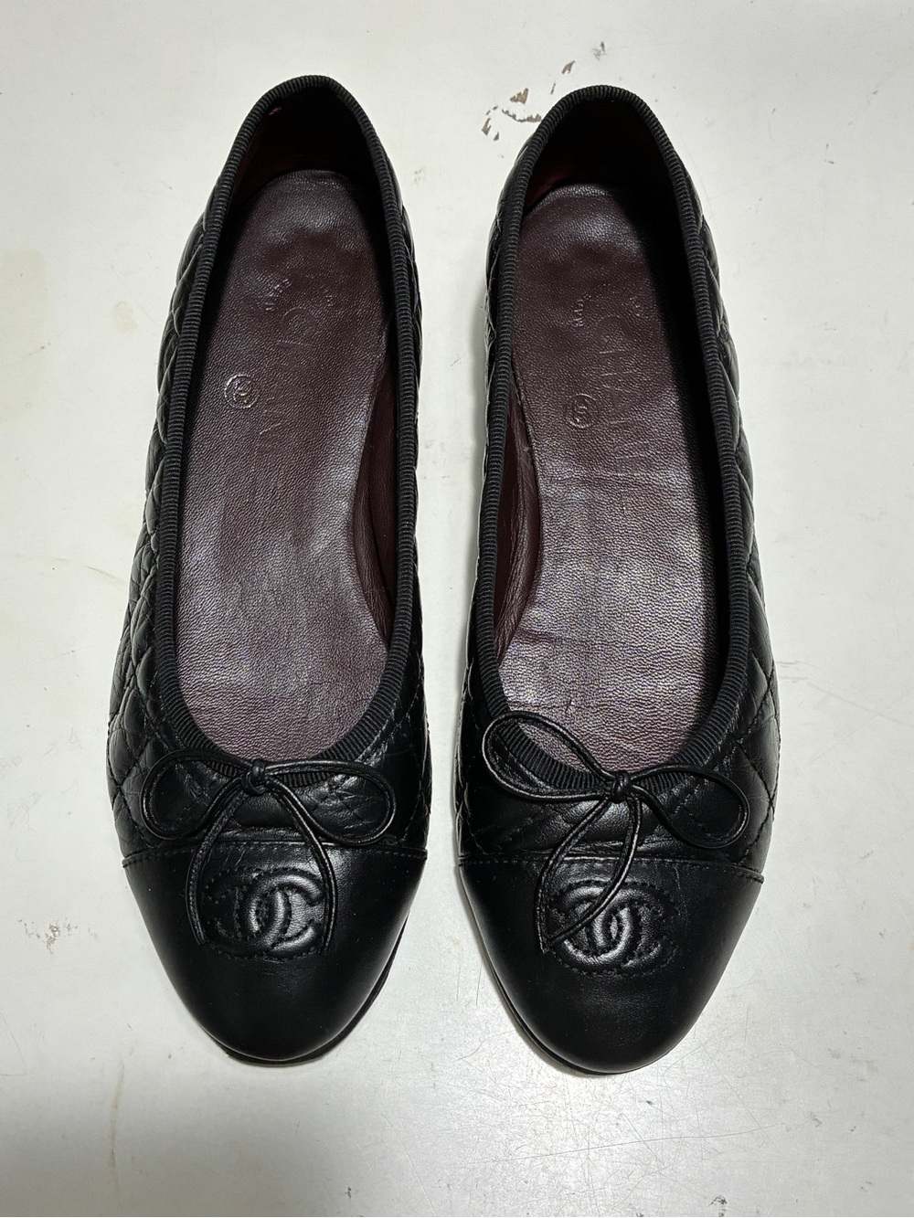 CHANEL Black Quilted Leather Ballet Flats with CC Medallion
